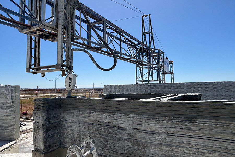 Image shows a Luyten 3D construction printer constructing a concrete wall.