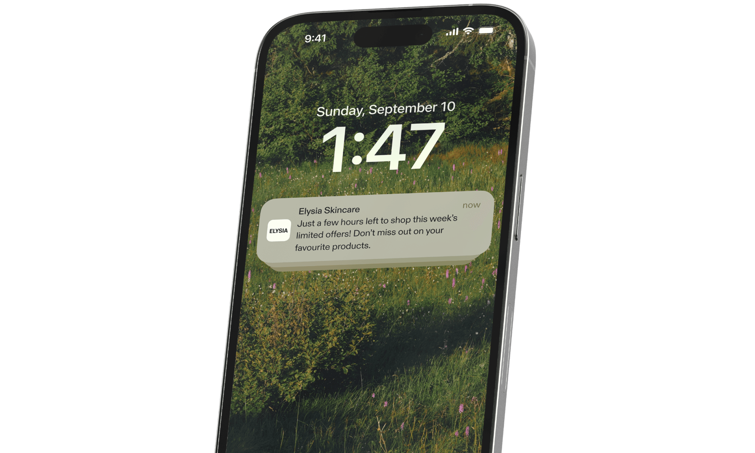 Smartphone displays a lock screen with a push notification from a skincare brand.