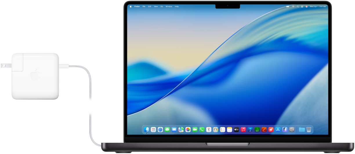 MacBook Pro s pripojeným napájacím adaptérom.
