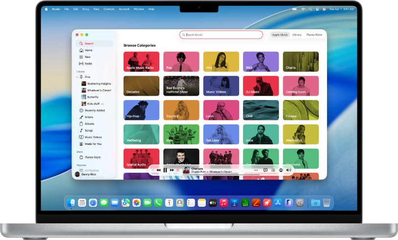 The Apple Music window showing the search field and category tiles.
