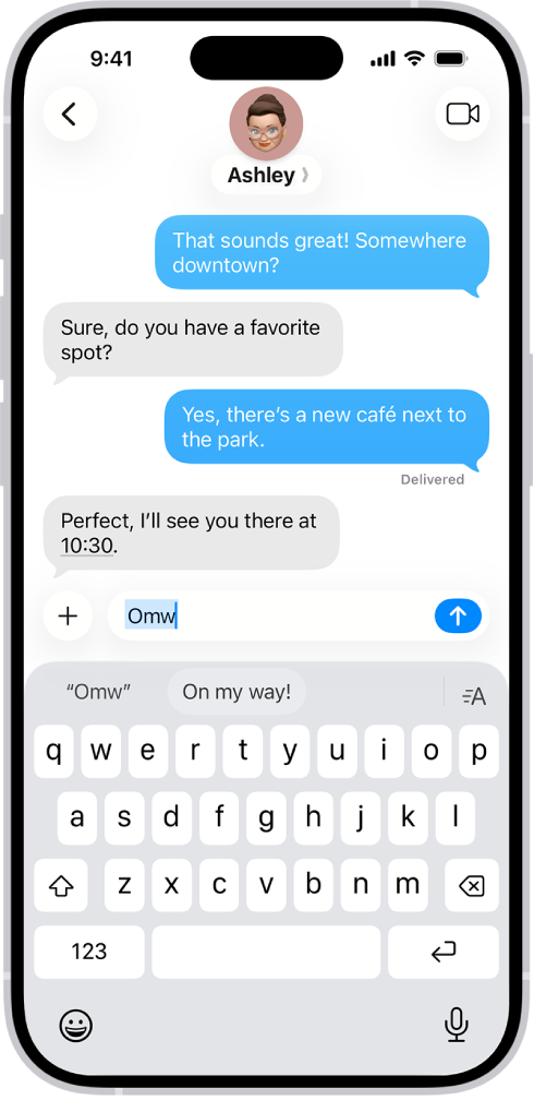 A message with the text shortcut “Omw” typed and the phrase “On my way!” suggested below as replacement text.