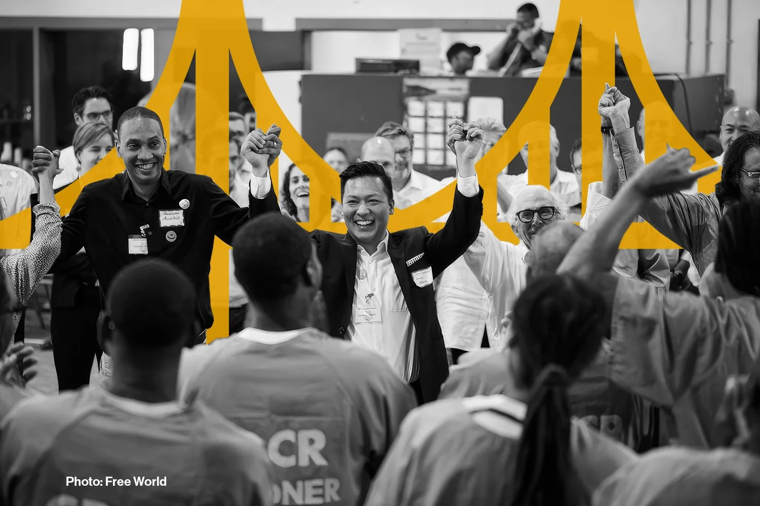 Photo of Free World Founder Jason Wang hand in hand with members of his organization and returning citizens.