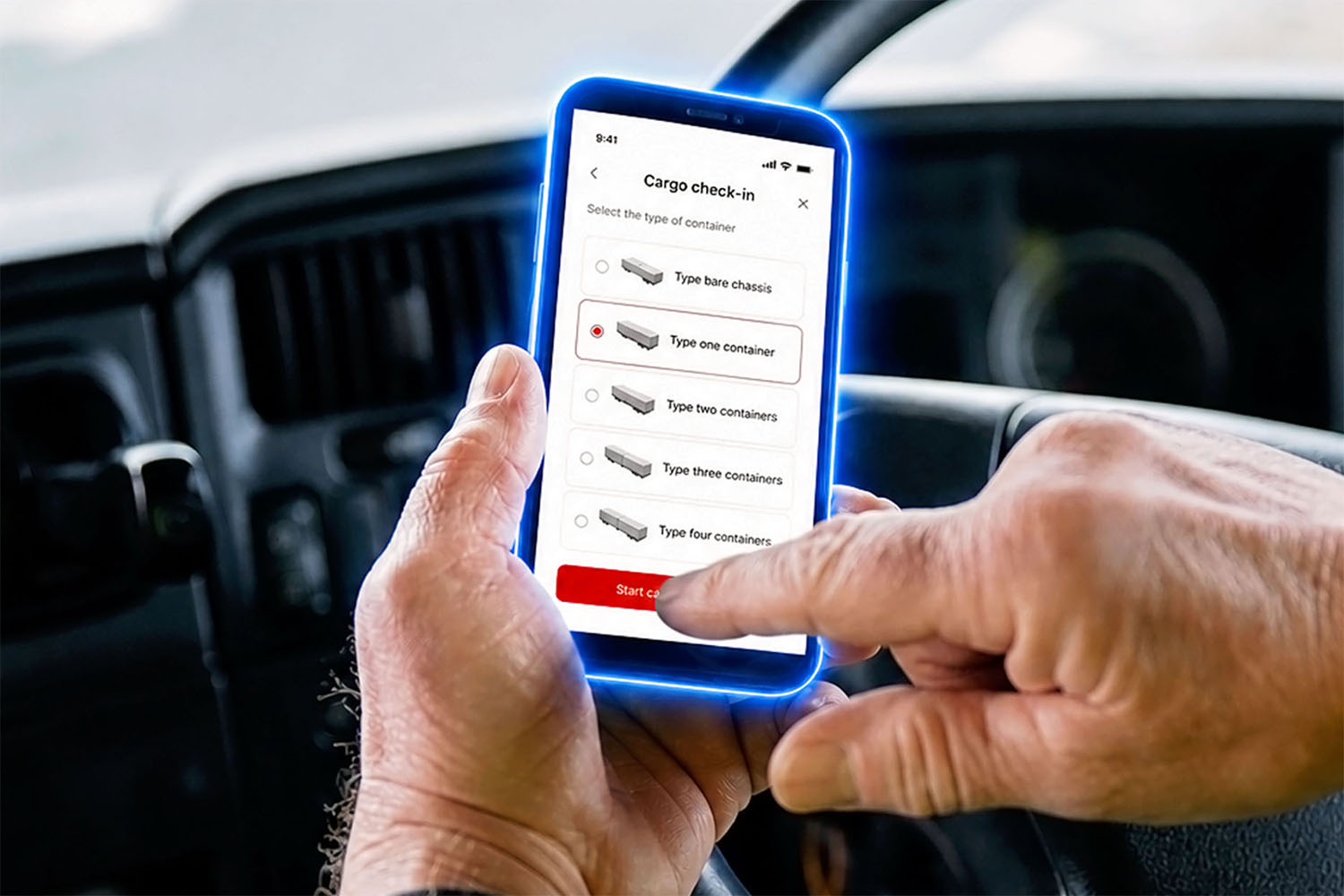 Driver clicks to check-in cargo using the TMEIC Pulse Mobile application on his phone