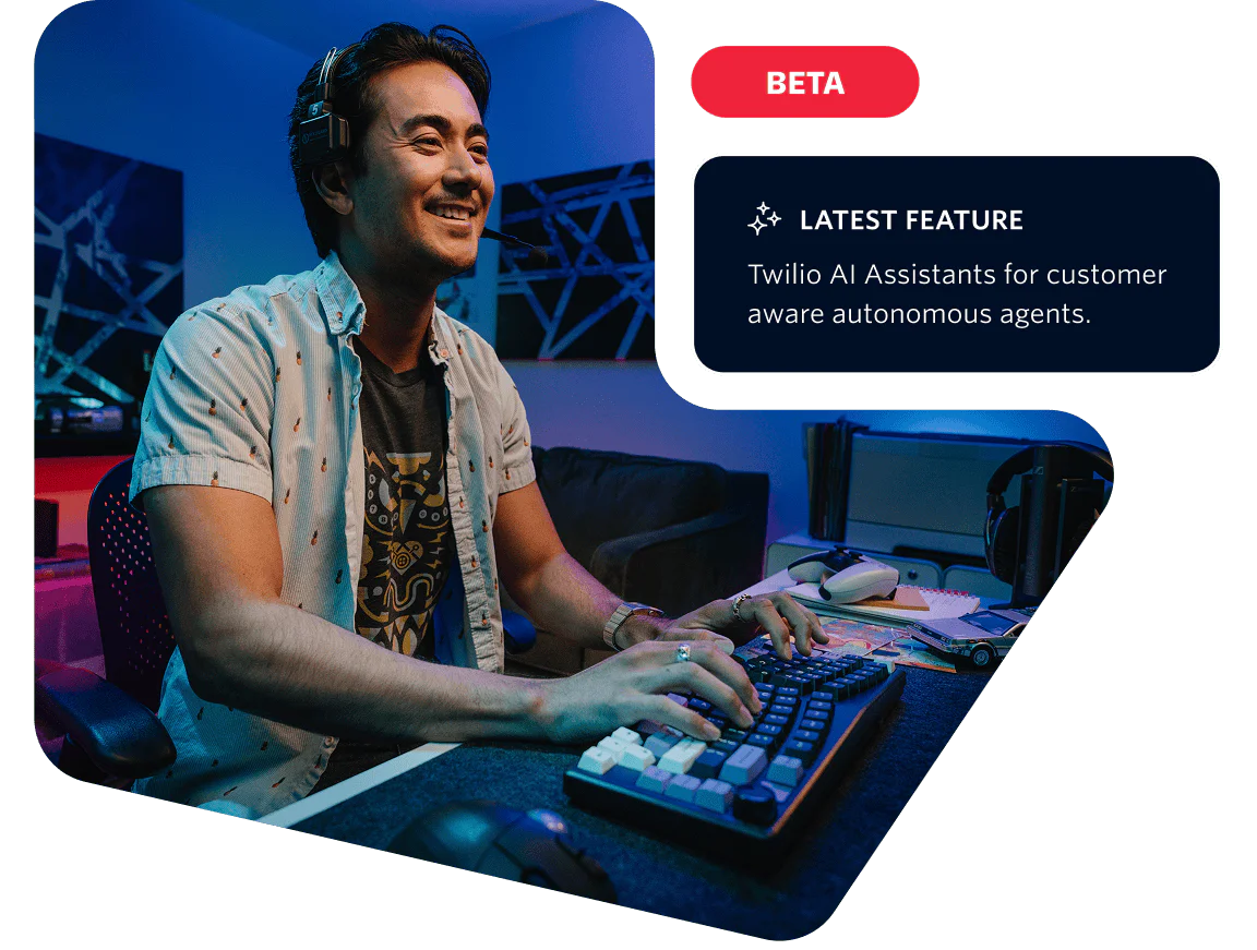 A man at a computer desk testing the Twilio AI Assistants feature in a beta environment.
